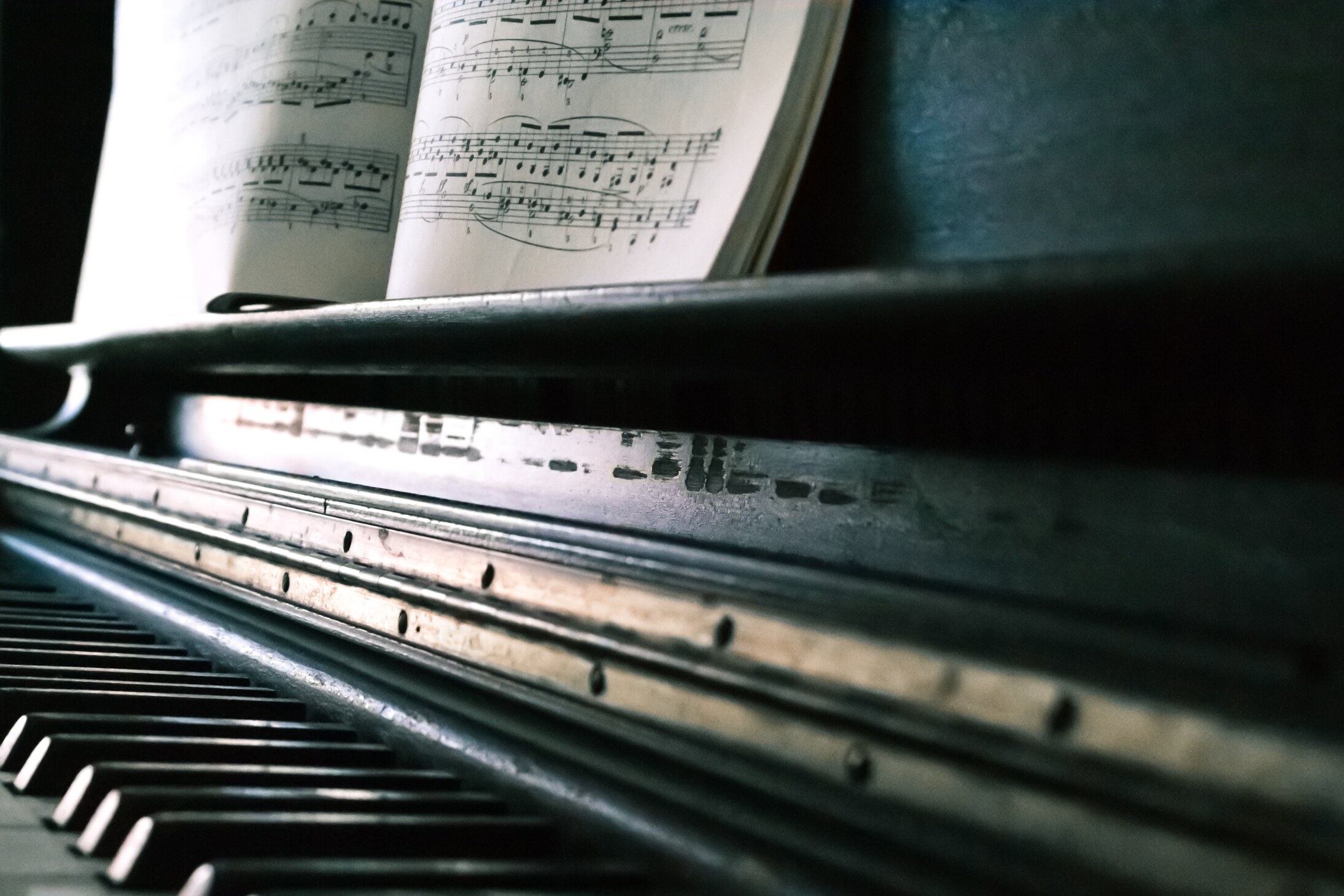 photo of a piano with sheet music